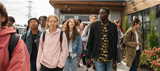 A group of young people walking together outside